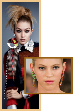 Large asymmetrical earrings on fashion models