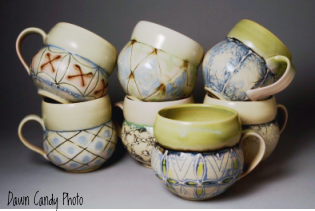 A photo of handmade pottery mugs by Dawn Candy